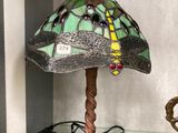 a lamp that is sitting on a glass table