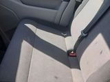 the back seat of a car with a seat belt in it