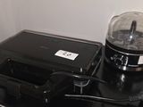 a blender sitting on top of a counter next to a toaster