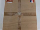 a cardboard box with a sticker on it sitting on a table