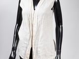 an image of a mannequin wearing a white vest and black pants