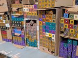 many boxes that are stacked up on a table