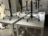 a room with a lot of tables and stools in it