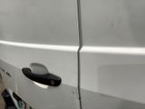 a white van parked on the side of the road