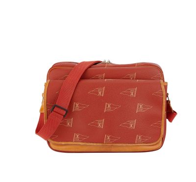 an image of a small red and yellow bag with a cat pattern on it