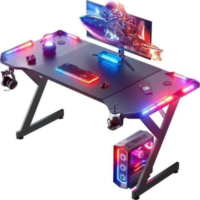 a close up of a gaming desk with a monitor and keyboard
