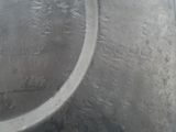 a close up of a metal object with a circular object in the background