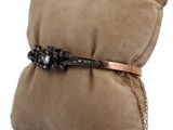 an image of a pillow with a bracelet on it