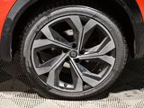 a close up view of a car ' s wheel on the ground