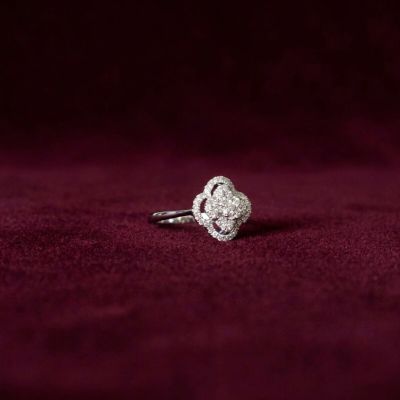 an image of a diamond ring on a red velvet background