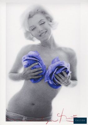 black and white photograph of a woman in a bikini holding two towels