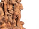 statue of a woman holding a child and a bird in her hand