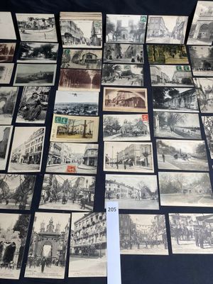 several old black and white photos of a bunch of buildings