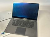 two laptops sitting next to each other on a table