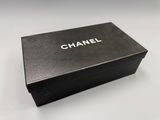 a close up of a black box on a white surface