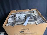 a cardboard box with a bunch of old photos in it