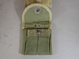 an image of a small pouch with a button on it