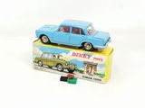 a blue toy car sitting on top of a box