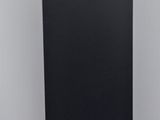 a statue of a man sitting on top of a black pedestal