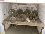 many pots and pans sitting on a table in a room