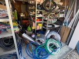 a garage with a lot of hoses in it