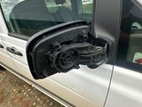 a white van with its door open and the side view mirror open