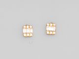 a pair of gold and diamond earrings