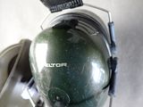 a close up of a helmet and headphones on a motorcycle