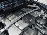 a close up of a car ' s engine with its hood open
