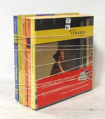 four books that are stacked on top of each other