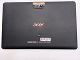 the back of a black laptop with a gold handle on a white surface
