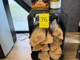 a pile of wood sitting on a table next to a box of chips