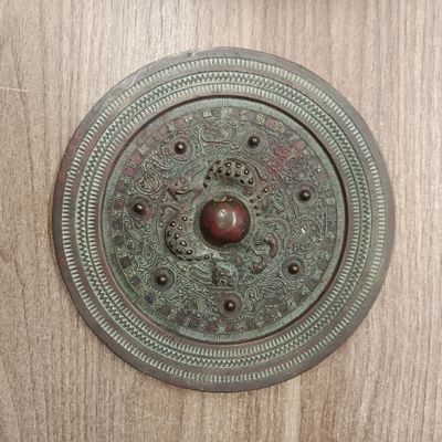 a close up of a door handle on a wooden door