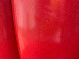 a close up of a red object with a blurry background