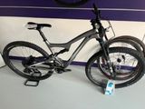 a bike that is sitting on the floor next to a wall