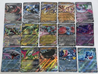 pokemon trading card game set with a lot of cards on the table