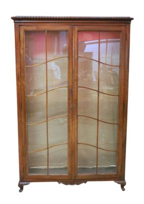 an image of a wooden cabinet with glass doors on top of it