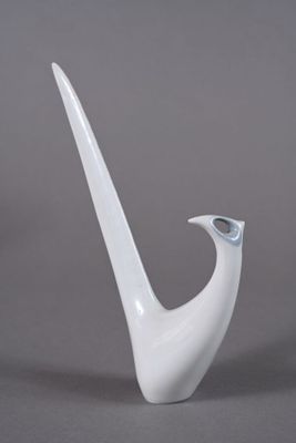 an image of a white vase with a curved handle