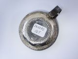 an antique silver plate with a tag on it