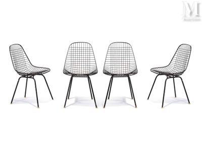 three black chairs sitting next to each other on a white surface