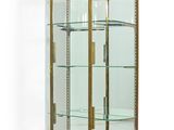 an image of a display case with glass shelves and a wooden base