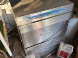 an image of a dirty kitchen with a dishwasher and other items