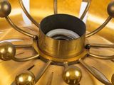 a gold plate with a gold flower on top of it