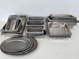 many metal pans that are sitting on a table