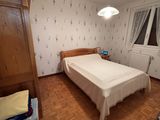 a bedroom with a bed and a dresser in it