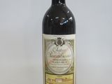 a bottle of wine that is sitting on a table