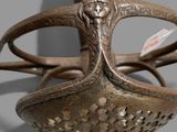 a close up of a metal object with a handle