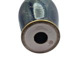a blue vase with a gold trim on it