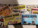 a lot of comic books sitting on a table
