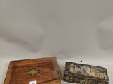 two small wooden boxes sitting next to each other on a white surface